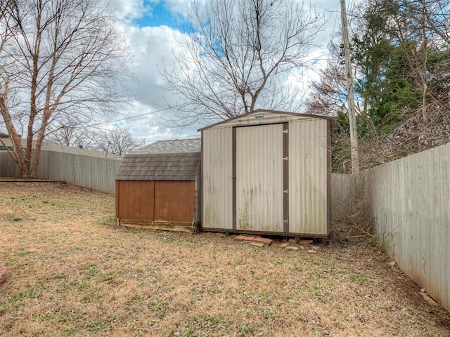 view of shed with a fenced backyard