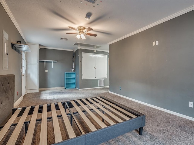 unfurnished living room featuring carpet, visible vents, and ornamental molding