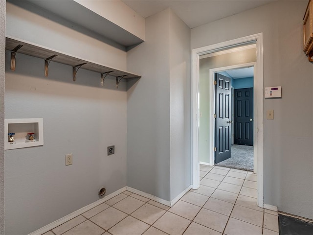 laundry area with laundry area, light tile patterned floors, baseboards, washer hookup, and electric dryer hookup