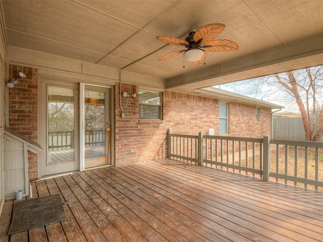 deck featuring a ceiling fan and fence