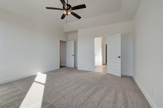 unfurnished bedroom featuring ceiling fan and light carpet