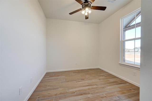 empty room featuring light wood-type flooring and ceiling fan