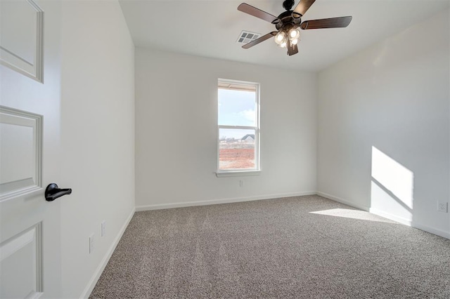 empty room featuring carpet and ceiling fan