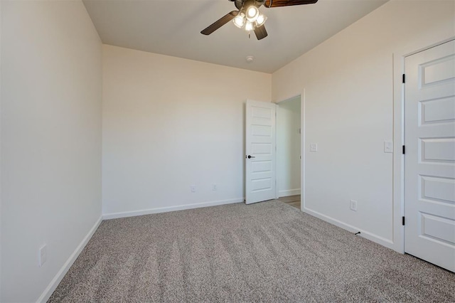 carpeted empty room with ceiling fan