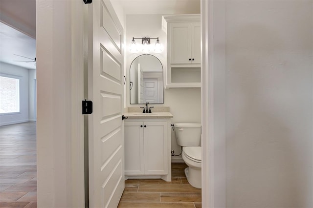 bathroom featuring toilet and vanity