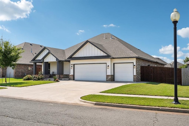 view of front of house featuring a garage and a front yard