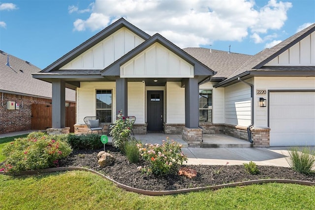 view of front of property featuring a porch and a garage