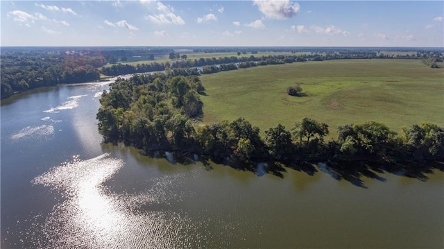 drone / aerial view with a water view and a rural view