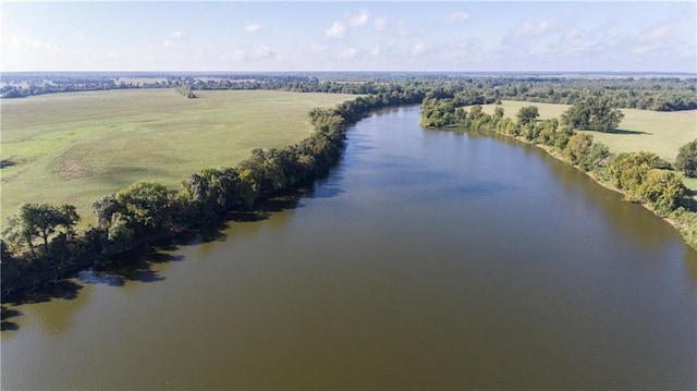 drone / aerial view with a water view and a rural view