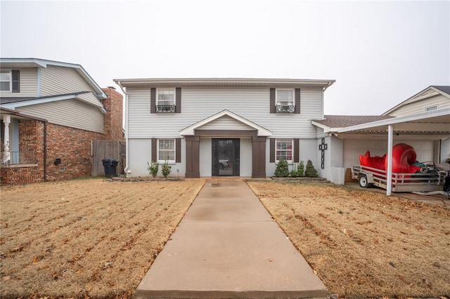 view of property featuring a front lawn