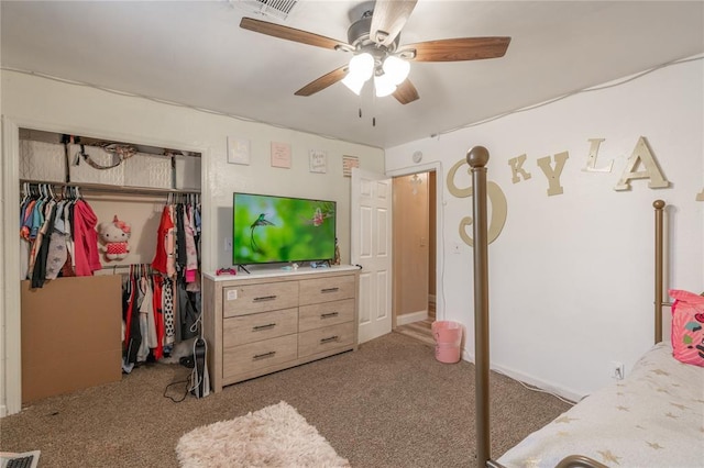 bedroom with light colored carpet, ceiling fan, and a closet