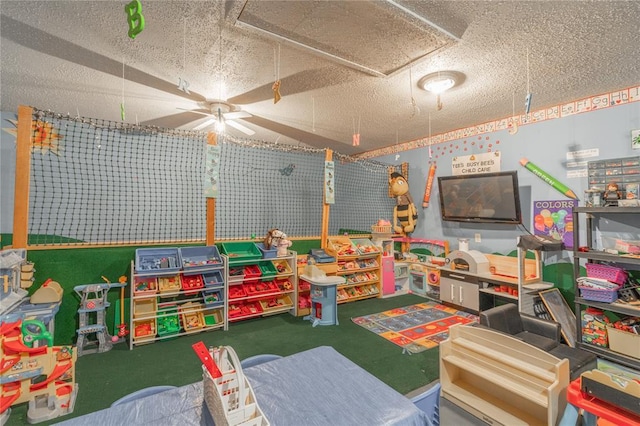 rec room featuring a textured ceiling