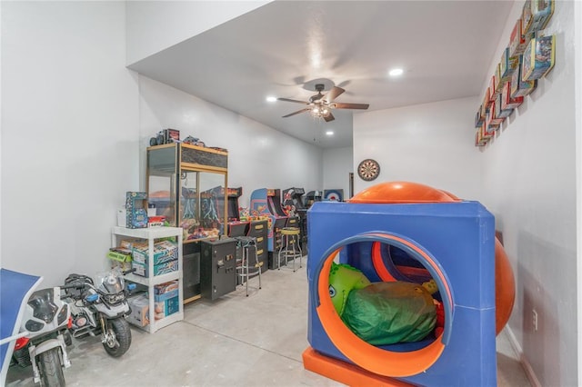 interior space with ceiling fan