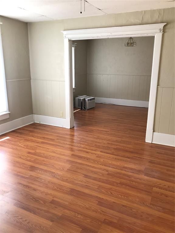 empty room with wood-type flooring