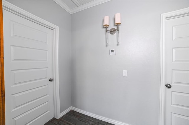 interior space with ornamental molding, dark hardwood / wood-style floors, and washer hookup