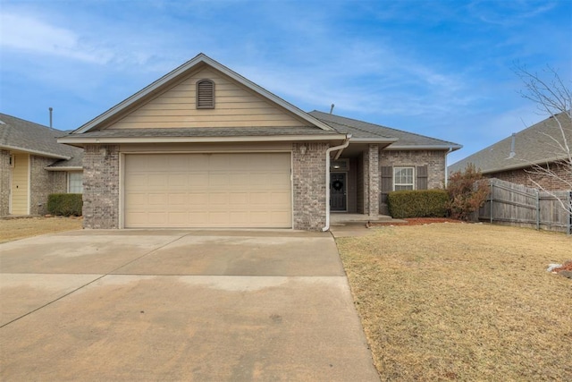 single story home featuring concrete driveway, brick siding, an attached garage, and fence