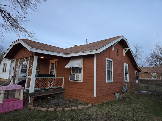 view of side of home featuring cooling unit