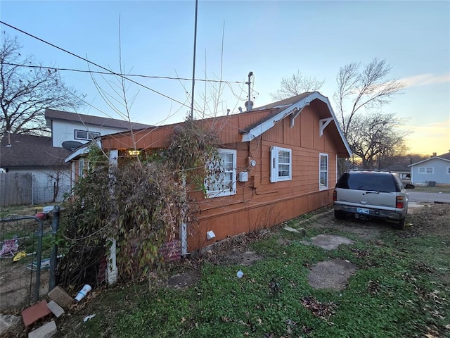 view of property exterior at dusk