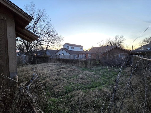 view of yard at dusk