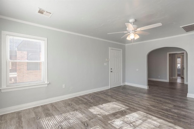 spare room with ornamental molding, dark hardwood / wood-style floors, and ceiling fan