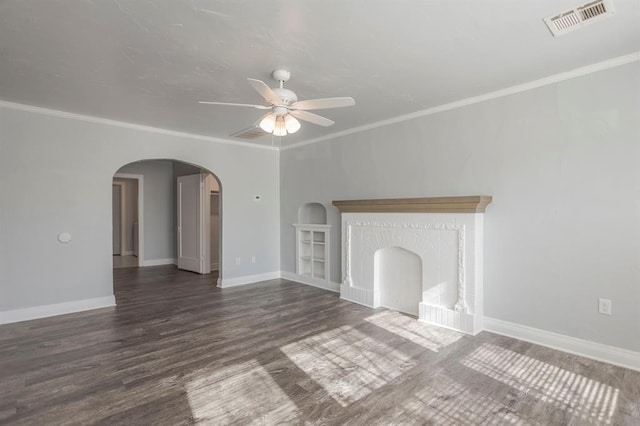 unfurnished living room featuring dark wood-type flooring, ceiling fan, and ornamental molding