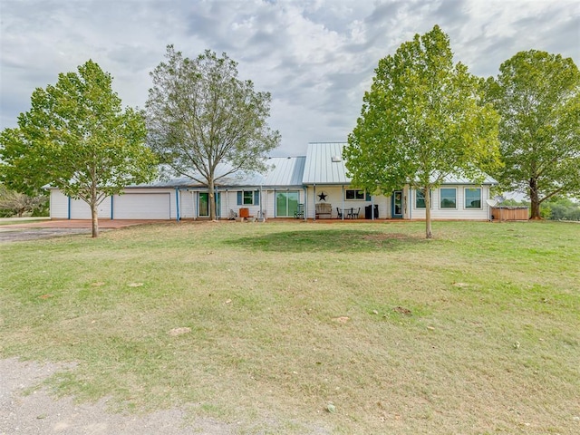 view of front facade with a garage and a front lawn