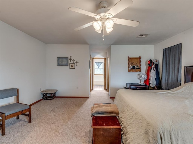 bedroom featuring light carpet and ceiling fan