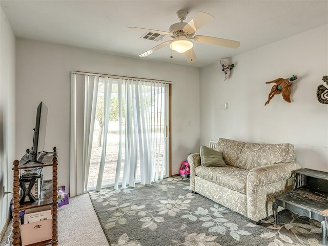 living room with carpet floors and ceiling fan