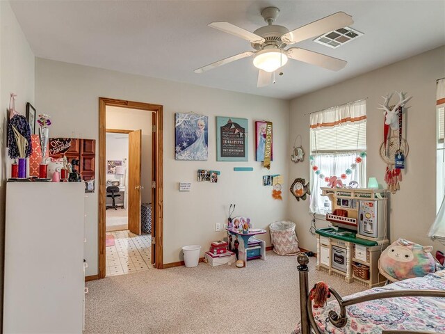 carpeted bedroom with ceiling fan