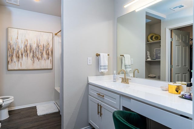 full bathroom with vanity, shower / bathing tub combination, hardwood / wood-style floors, and toilet