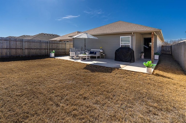 rear view of house featuring a patio area and a lawn