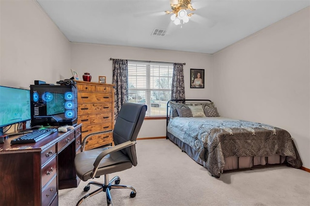 bedroom featuring light colored carpet and ceiling fan