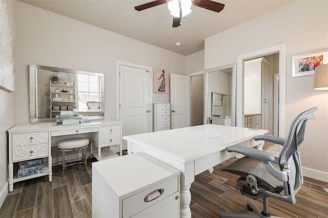 office space with dark wood-type flooring and ceiling fan