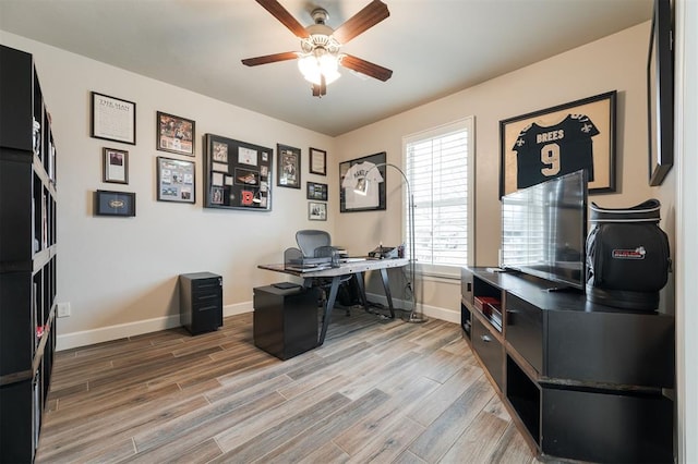 office area featuring wood-type flooring and ceiling fan