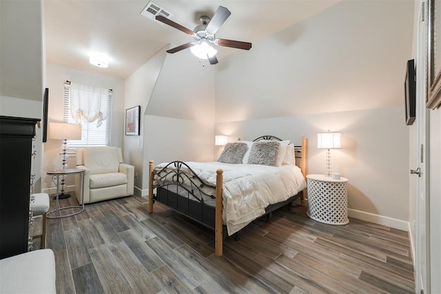 bedroom with dark hardwood / wood-style flooring, lofted ceiling, and ceiling fan