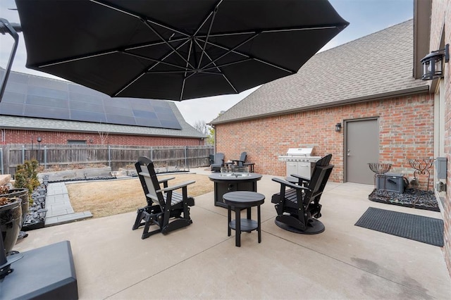 view of patio / terrace featuring an outdoor fire pit