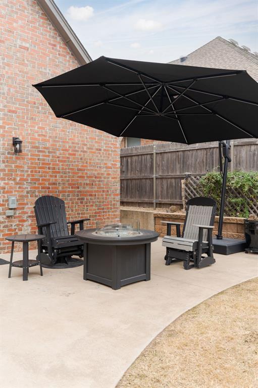 view of patio / terrace featuring an outdoor fire pit