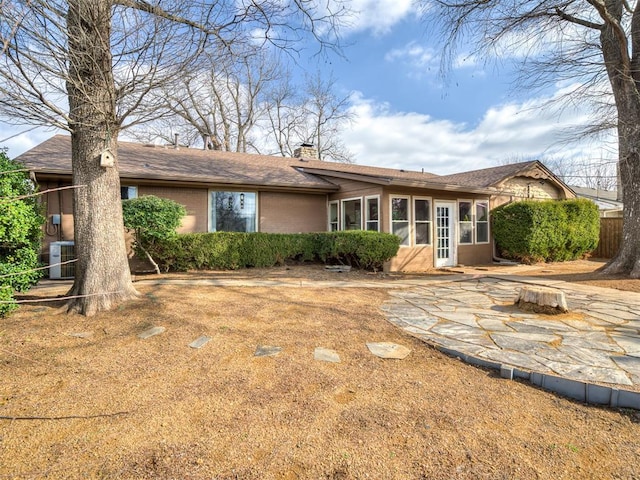 back of house featuring a patio and central air condition unit