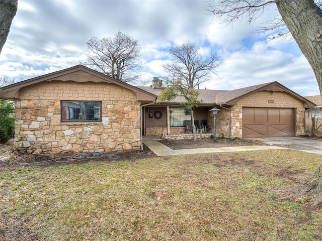 ranch-style home featuring a garage and a front yard