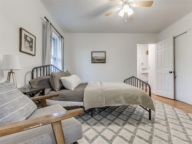 bedroom featuring ceiling fan and wood-type flooring