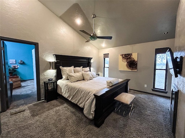 bedroom featuring ceiling fan, lofted ceiling, and dark carpet