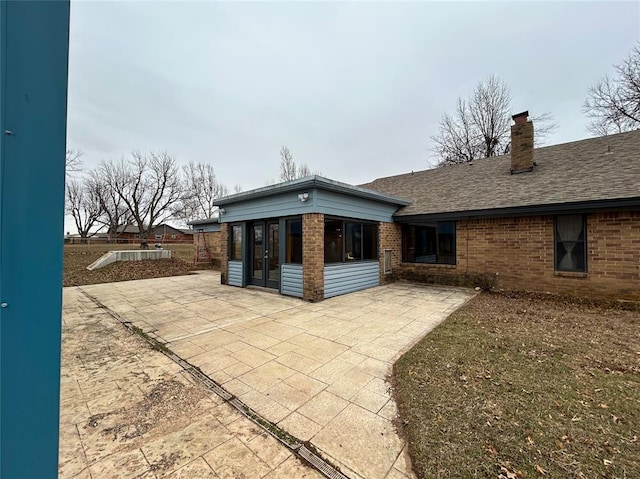 back of property featuring a patio