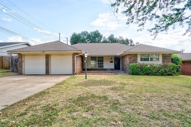 ranch-style home with a garage and a front yard