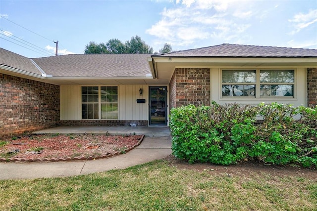 property entrance with a yard