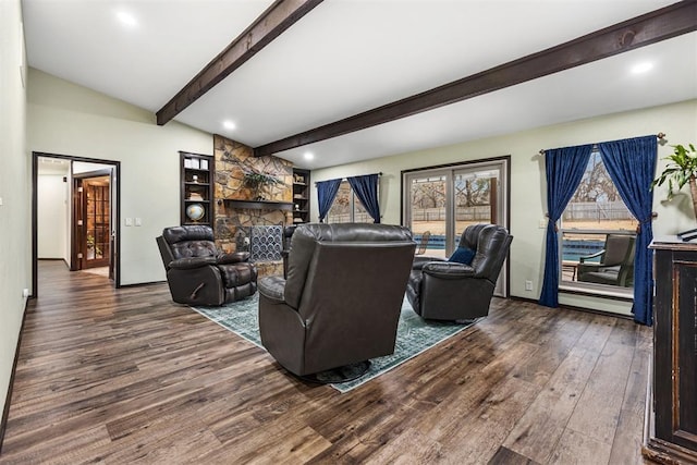 living room featuring a baseboard radiator, a stone fireplace, dark hardwood / wood-style floors, and beam ceiling