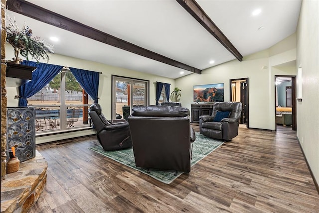 living room with beam ceiling, baseboard heating, and hardwood / wood-style flooring