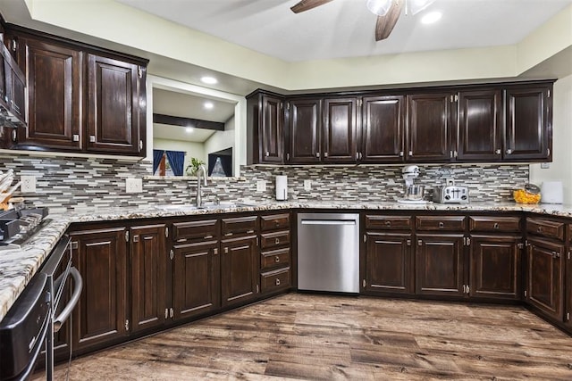 kitchen featuring hardwood / wood-style flooring, dishwasher, sink, and dark brown cabinetry