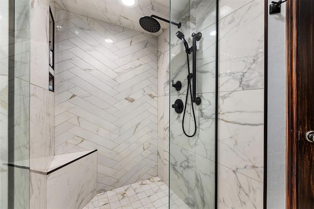 bathroom featuring a tile shower