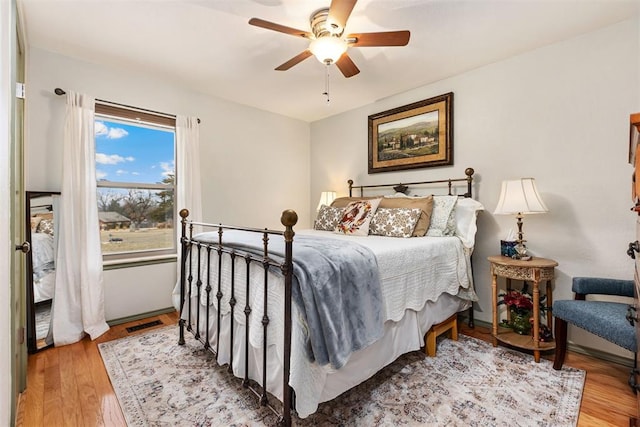 bedroom featuring hardwood / wood-style floors and ceiling fan