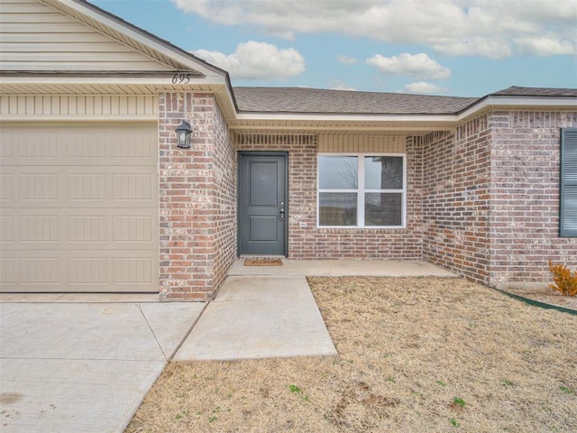 doorway to property featuring a garage